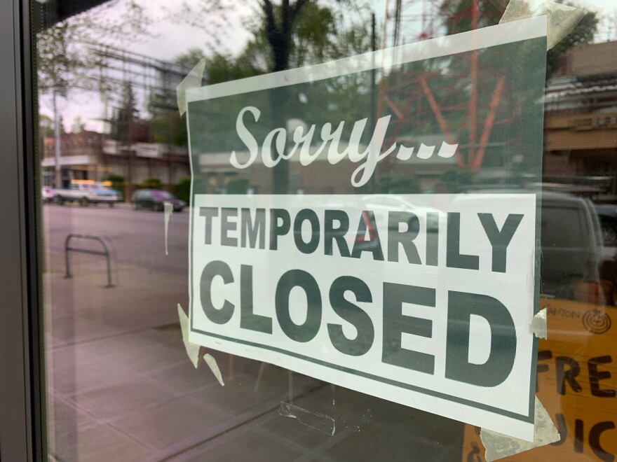 Signs like this one reading "Temporarily Closed," in a storefront in Seattle's Queen Anne neighborhood, are common sights around the country right now.