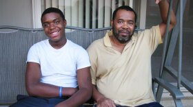 Clyde Jackson (right) poses for a photo with his son, Clyde Jr., outside their new two-bedroom apartment in Greenbelt, Md. Jackson lost his three-bedroom home to foreclosure in December.