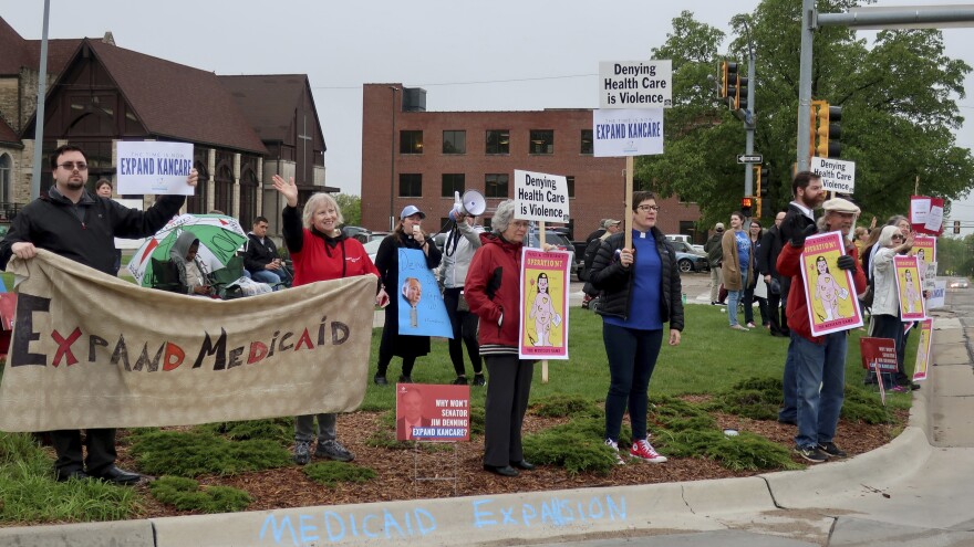 Advocates for expanding Medicaid in Kansas staged a protest outside the entrance to the statehouse parking garage in Topeka in May 2019. Today, twelve states have still not expanded Medicaid. The biggest are Texas, Florida, and Georgia, but there are a few outside the South, including Wyoming and Kansas.