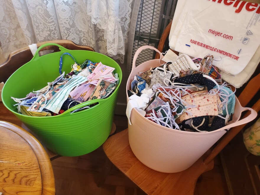 buckets full of cloth masks