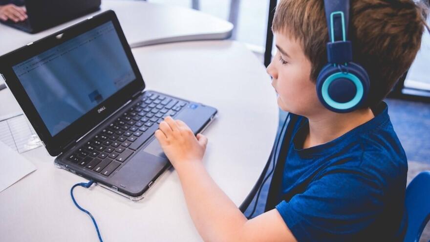 A student works on a computer at Alpha School in Austin, Texas. Alpha School advertises 2-hour, daily learning blocks customized by AI followed by hands-on projects and life skills lessons. It's on track to open locations in Edmond and Tulsa this fall.