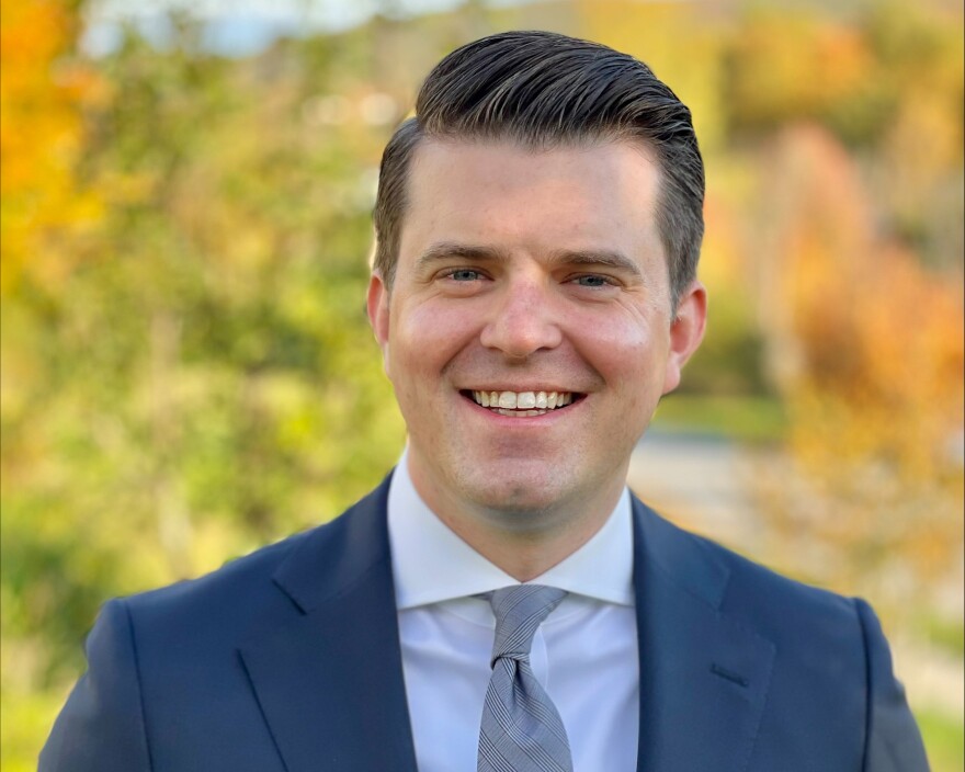A man in a blue suit.