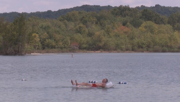 A man swims on Lake Monroe, August 2019.