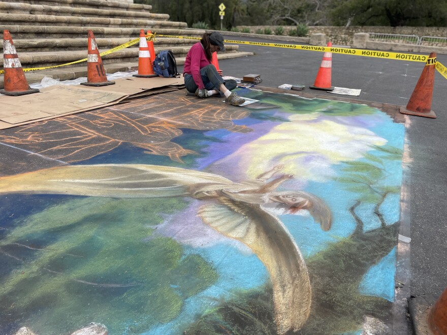 Artist Lorelle Avonne Kozoll Miller is using pastels to create a street painting outside the Mission in Santa Barbara