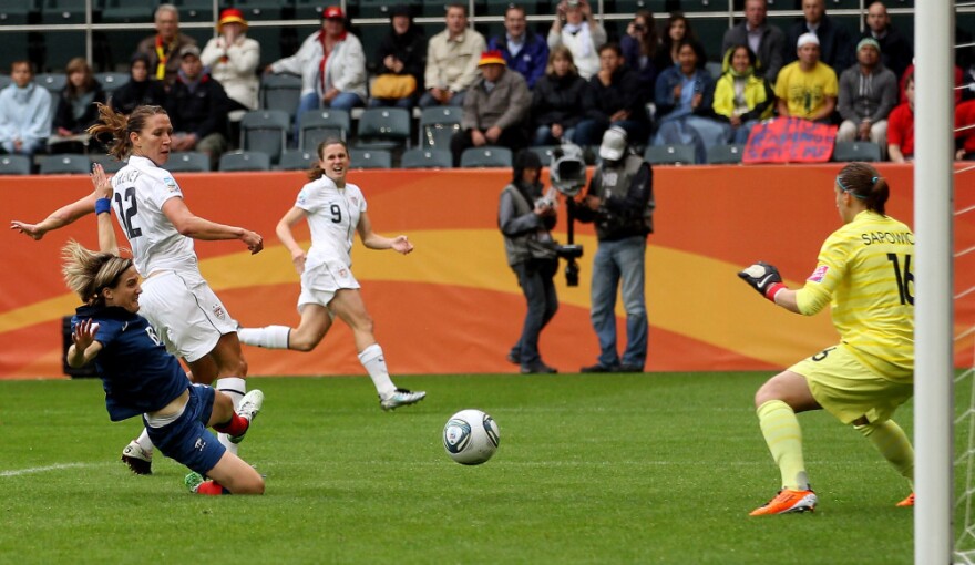 Lauren Cheney of the U.S. scores an early goal after a low, hard pass from Heather O'Reilly, during the FIFA Women's World Cup 2011 semifinal match with France.