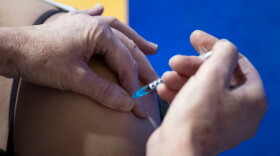 A coronavirus vaccination is given at Cardiff and Vale Therapy Centre on December 8, 2020, in Cardiff, Wales. More than 50 hospitals across U.K. were designated as COVID-19 vaccine hubs, the first stage of what will be a lengthy vaccination campaign. (Matthew Horwood/Getty Images)