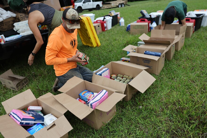 The Office of Hawaiian Affairs and Vertical Worx prepare and make deliveries on Aug. 18 to families isolated by Hurricane Lala.