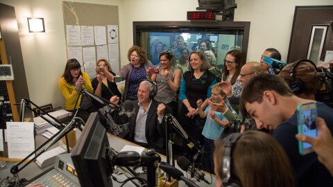 KPLU General Manager Joey Cohn, surrounded by KPLU staff and local media, announced that the Save KPLU campaign has hit its fundraising goal.