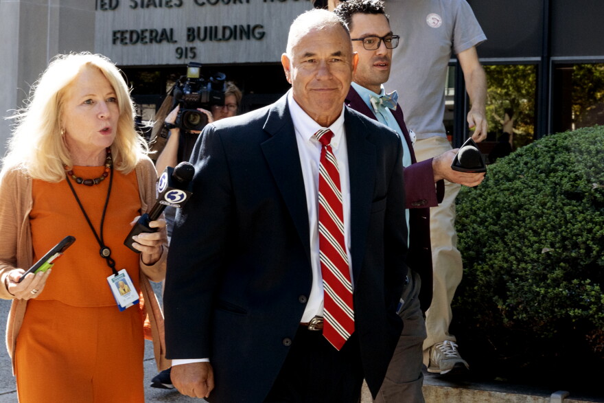 FILE: Reporters follow Kosta Diamantis as he leaves the U.S. District Court in Bridgeport during a break in his trial on Oct. 6, 2025.