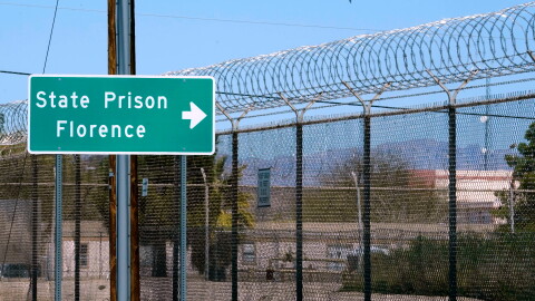 A sign points in the direction of the Arizona State Prison in Florence, Ariz., March 19, 2025.