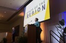 Two presenters stand on stage at a University of South Florida ballroom during the 2026 State of the Region event. 
