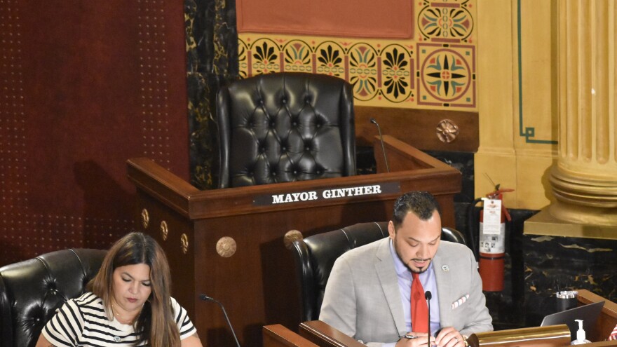 A chair for Columbus Mayor Andrew Ginther sits empty at a Columbus City Council meeting on July 21, 2025.