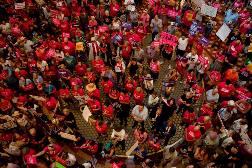 abortion rights supporters fill the state capitol rotunda