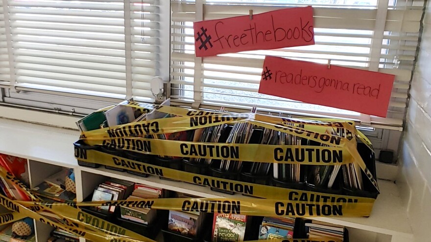A teacher in Duval County books submitted a photo of classroom books covered by caution tape to WJCT News.