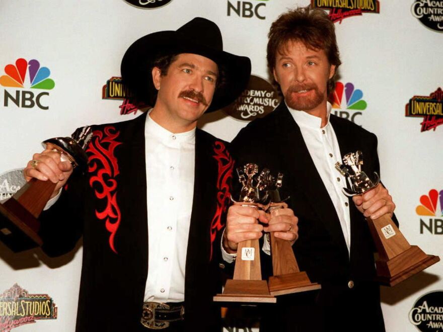 Kix Brooks (left) and Ronnie Dunn at the hold the awards they won during the 1996 Academy of Country Music Awards, where the duo won the award for Entertainer of the Year.