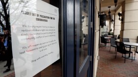 A hotel in Chapel Hill, N.C., is closed along with many restaurants, bars and businesses due to the coronavirus, March 17, 2020. North Carolina Gov. Roy Cooper’s decisions during the COVID-19 pandemic that resulted in bars being shuttered or severely restricted while restaurants that served alcohol could reopen were "illogical" and don't appear justified by evidence, a state appeals court ruled Tuesday, April 16, 2024. (AP Photo/Gerry Broome, File)