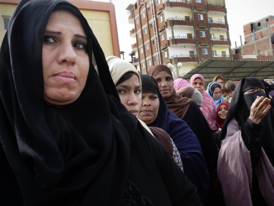 Women stand in line to cast their votes in Suez, Egypt, on Wednesday. For months after the revolution, the port city had no government or services. Some voters are turning to the Salafists or the Muslim Brotherhood to bring change.