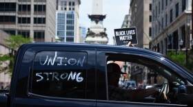 Union workers at a car rally outside the Indiana Statehouse.