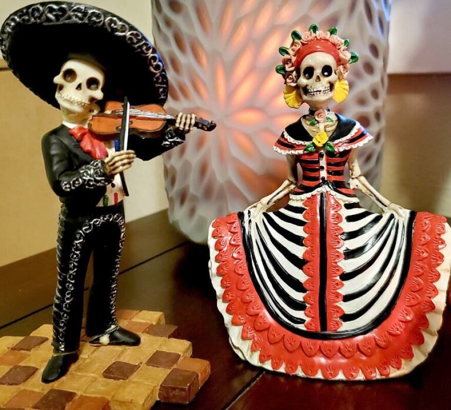 Sara Padilla of West Linn’s Day of the Dead altar includes figurines, and memorials for family members and a cherished pet.