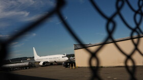 FILE - A U.S. Immigration and Customs Enforcement flight operates out of King County International Airport-Boeing Field, Aug. 23, 2025, in Seattle.
