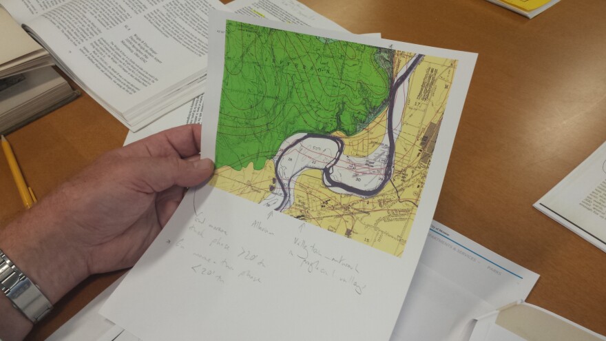 University of Dayton Geology professor Dr. Micheal Sandy holds a topographical map of the Pinnacles.