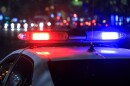 Flashing red and blue lights on a police car at night