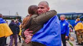 A Ukrainian soldier is welcomed after returning from captivity after a Prisoners of War (POWs) exchange between Russia and Ukraine, at an undisclosed location, Ukraine, Friday, Oct. 23, 2026.