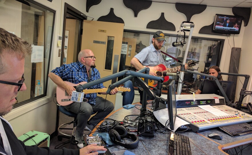 Charlie & The Regrets performing a song in the KETR Studios. (Left to right) Lap Steel Guitarist Willy Golden, Lead Guitarist John Shelton, Singer & Guitarist Charlie Harrison, and Bassist/Backup Vocalist Mark Riddell.