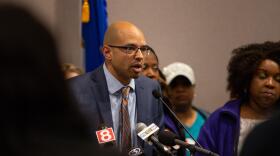 Rob Baril, president of the New England Health Care Employees Union, District 1199 SEIU, speaks about wage increases for workers at a press event in April.