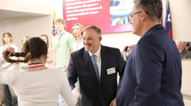 Northwest ISD Superintendent Mark Foust shakes a student’s hand during a school board meeting Feb. 26, 2024, at the district’s administration building in Justin.