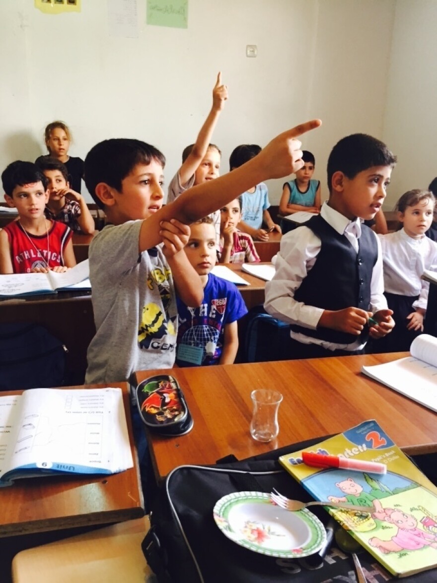 Syrian refugee students in southern Turkey take an English class at the Al Salam school. It opened in 2012 and survives on private donations. A number of others have had to close.