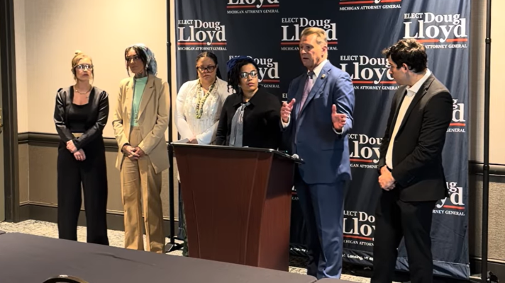 Eaton County Prosecuting Attorney, Republican Doug Lloyd, second from the right, criticizes his Democratic opponent in the race for Michigan attorney general of advocating a policy that "ignores the realities of the sex trade."