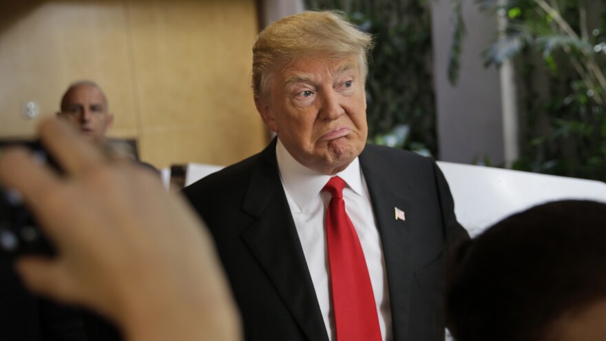 Donald Trump talks to reporters just before casting his ballot in New York Tuesday. With more big wins, Trump could be on his way to the GOP nomination.