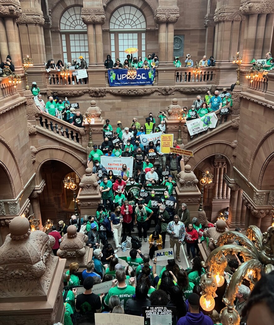 A climate change rally fills the grand staircase at the state capitol building Mar. 20, 2024.