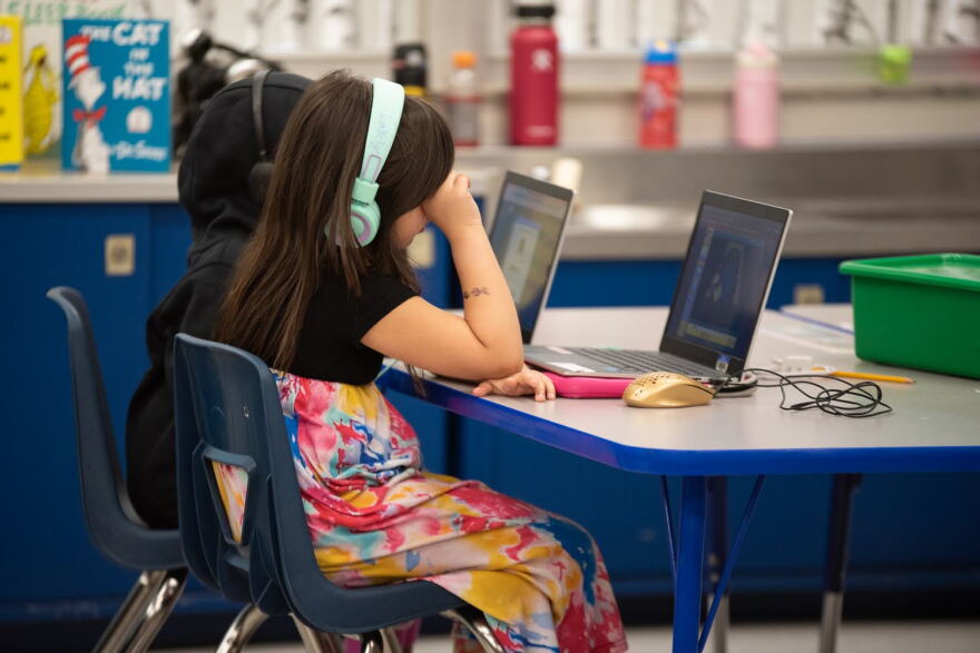 First graders work on assignments on laptops at Epic Charter Schools' Stonegate Virtual Learning Center in Oklahoma City on Feb. 28, 2023.