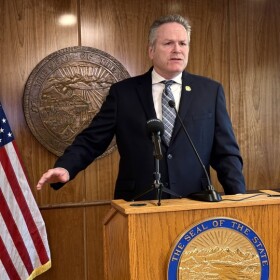 Gov. Mike Dunleavy speaks to reporters at a news conference in Juneau on June 19, 2026.