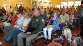 Community members pack the Old Wilson Schoolhouse Community Center on Aug. 7, 2026.