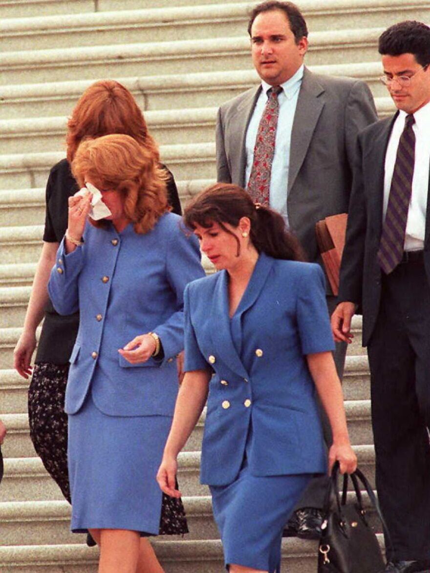 Members of Sen. Bob Packwood's staff walk down the Capitol steps after he resigned on the Senate floor in Washington, D.C., on September 7, 1995