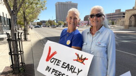 Michelle Schofield (L) and Rosa Weiss (R) holding signs on Lomas Wednesday October 7, 2026 on the first day of early voting for the general election on November 3, 2026.