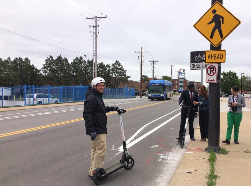 Eric Vaughan from BikeWalkKC tries out RideKC's new electric scooter at 18th and Lidia, where new bike and scooter lanes have recently been installed.