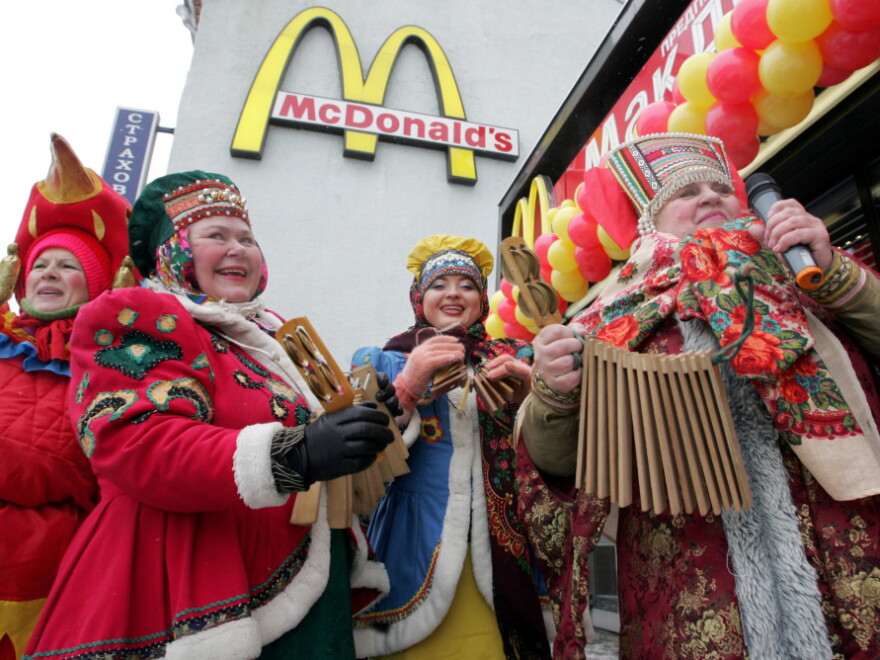 Traditionally dressed Russian musicians perform in front of the McDonald's restaurant in Moscow's Pushkin Square on Jan. 31, 2005, the 15th anniversary of its opening. It was the first McDonald's opened under Soviet rule.