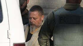 Officers escort Richard Matthew Allen out of the Carroll County courthouse following a hearing, Nov. 22, 2022, in Delphi, Ind. Allen confessed multiple times to the murders of two teenage girls — Abigail Williams, 13, and Liberty German, 14 — he is charged with killing in a phone call to his wife while in prison, according to court documents released Wednesday, June 28, 2023.