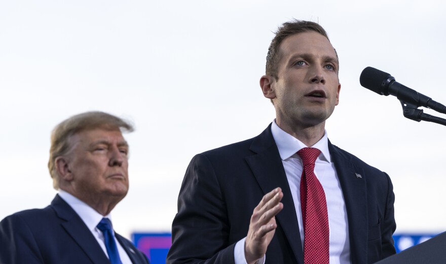 Former President Donald Trump listens as Max Miller, Republican nominee for Ohio's 7th Congressional District, speaks during a rally on April 23 in Delaware, Ohio.