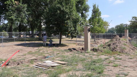 A member of the State Historical Society of North Dakota and a member of the North Dakota Geological Survey perform soil tests on Aug. 26, 2026, near the governor’s residence where human remains were discovered as part of a fence and driveway project on the Capitol grounds.
