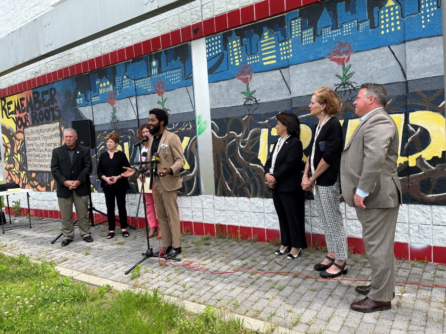 Albany Juneteenth Organizer Trayvon Jackson, flanked by Capital Region officials.