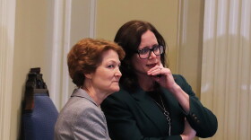 Senate Minority Leader Kay Floyd, left, and Minority Leader-elect Julia Kirt, right, have a quiet conversation before the start of Gov. Stitt’s “Goodbye Grocery Tax” press conference on Feb. 27, 2024, at the Oklahoma State Capitol.