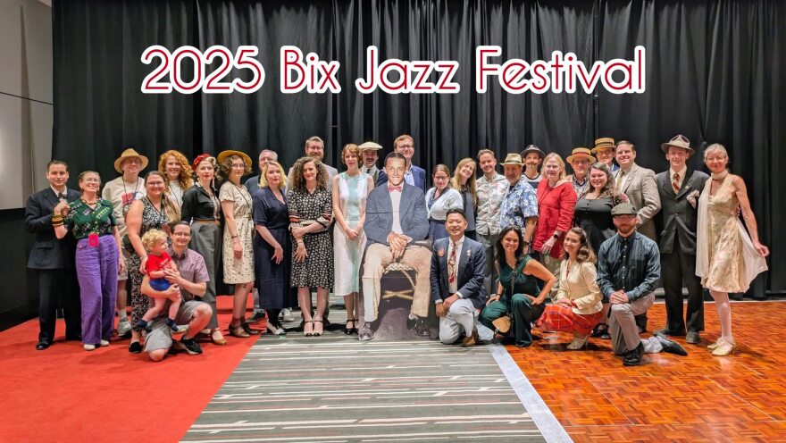 Many Bix fans dressed up for the 2025 Bix Jazz Festival, at the Rhythm City Event Center, posing with a cutout of the famous Davenport native, cornetist and composer.