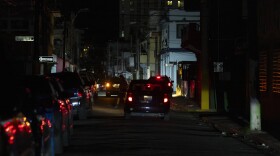 A street is dark during a blackout in San Juan, Puerto Rico, after sunset on Tuesday, Dec. 31, 2024. 