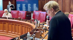 Sen. Cathy Osten defending the SEBAC deal. Watching is one of those who spoke against it, Sen. Craig Miner.