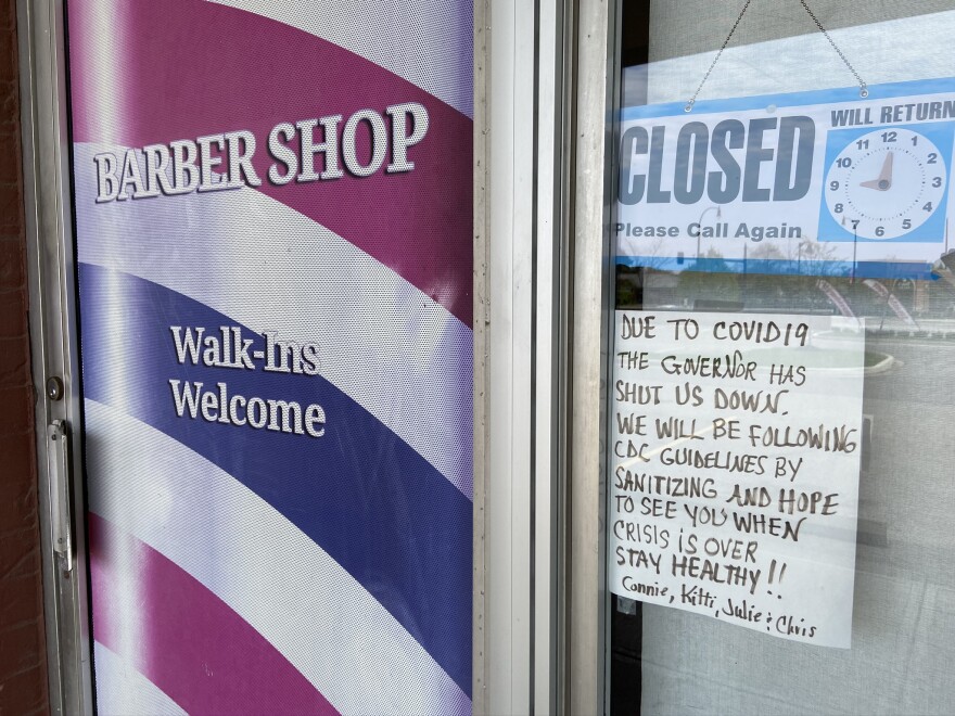 A sign on a closed barbershop in Westerville. Hair stylists are among the workers who have been waiting to apply for benefits.